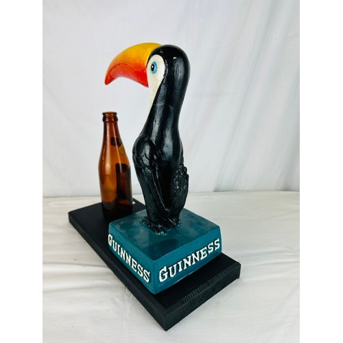 38 - GUINNESS TOUCAN RESIN ADVERTISING RESIN FIGURE MOUNTED ON WOOD
WITH OLD GUINNESS BOTTLE H24CM W34CM ... 