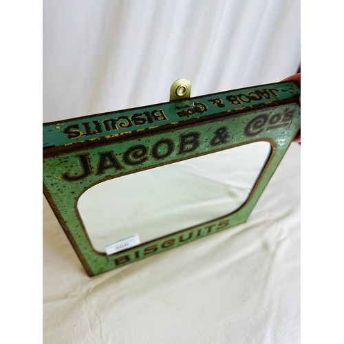 300 - OLD JACOBS AND COMPANY WALL MOUNTED TIN PICTORIAL MIRROR, 1930'S