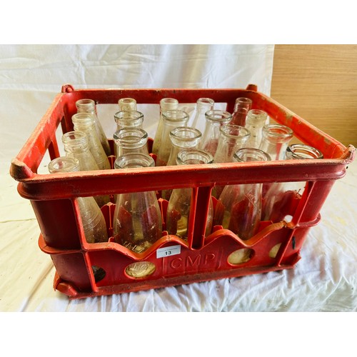 13 - A COLLECTION OF 24 MILK BOTTLES WITH CORK MILK PRODUCERS CRATE