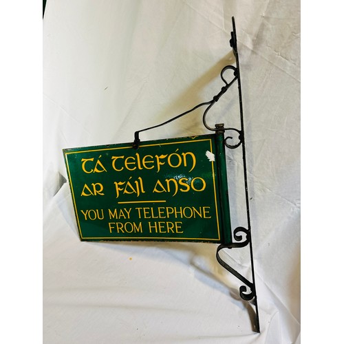 125 - VINTAGE 1940'S ENAMEL SIGN 'YOU MAY TELEPHONE FROM HERE' WITH ORIGINAL CAST IRON WALL HANGER, (SIGN ... 