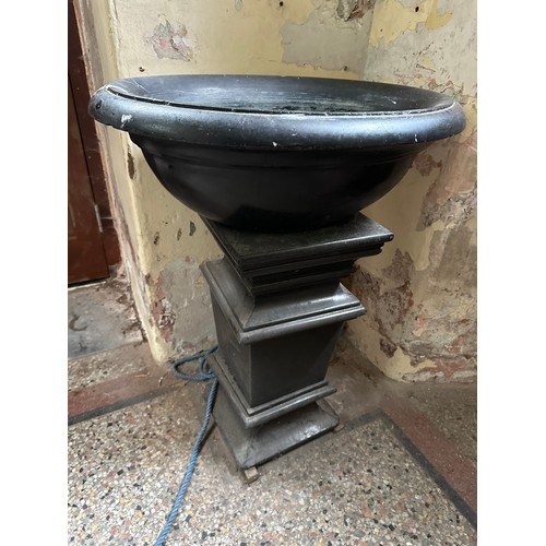 241 - Magnificent black marble (we assume its marble) oval holy water font, 23''w x 32''w x 40''h