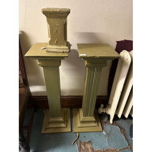 251 - A pair of painted plant stands and another, 32''h