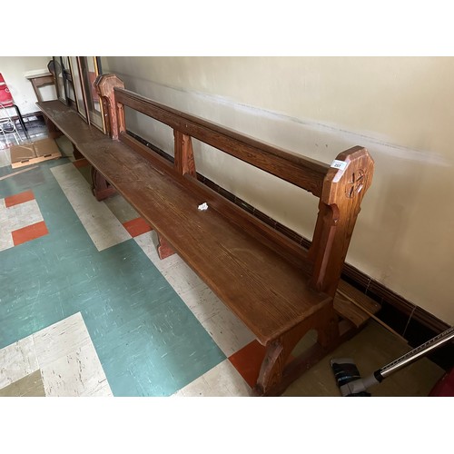 257 - A pair of solid pine church pews with kneelers, 8ft long