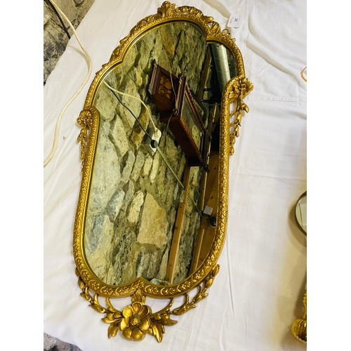 28 - Large ornate brass mirror, 37'' x 18''