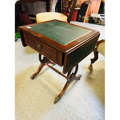 31 - Leather topped drop leaf side table on castors, 14'' x 18'' x 21''h