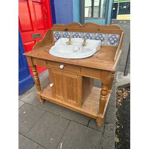 422 - Pine washstand with tiled back, includes sink and taps, 22''d x 40''w x 44''h