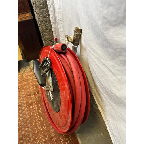 276 - Wall mounted fire hose and reel