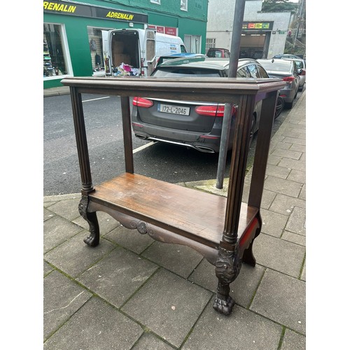 394 - 2 tier Georgian dumb waiter with profusely carved hairy claw feet. 46''w x 20''d x 4'h