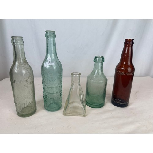 107 - A collection of vintage Irish bottles including Spillanes of Limerick and Nash's of Newcastlewest