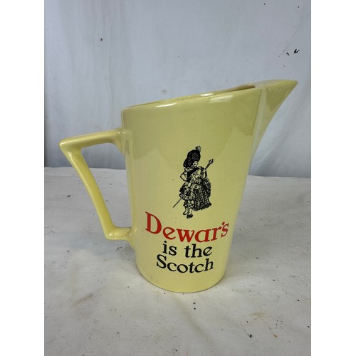 299 - Dewar's jug by Wade and a Dewar's glass jug