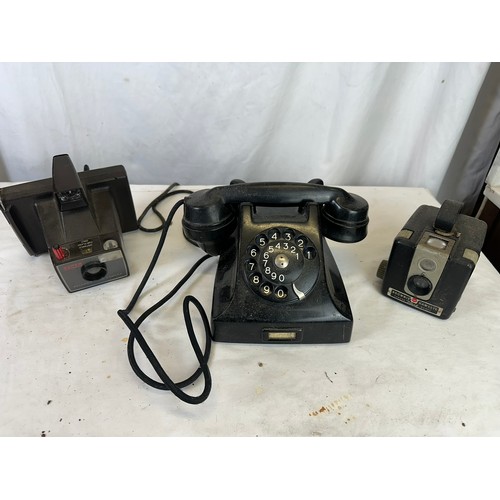 345A - Vintage black telephone, Brownie Hawkeye Camera Flash model and a Polaroid Land Camera Super Swinger