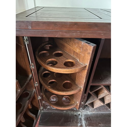 65 - Profusely carved on all sides Chinese expandable bar cabinet, solid wood, brass fittings, with 2 doo... 