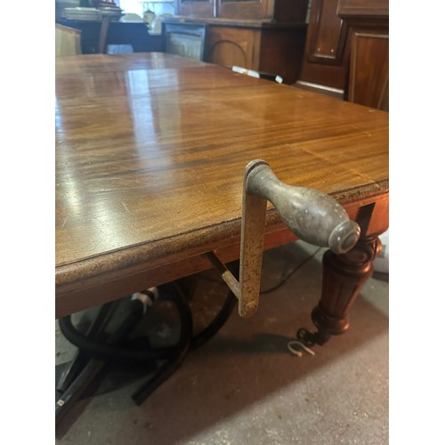 144 - Superb large Georgian oak dining winding extendable table with centre leaf. Robust legs and large br... 