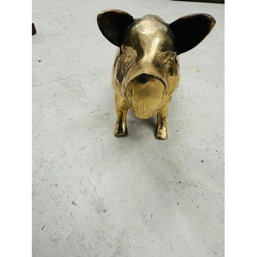 41 - Large farmhouse Pig, solid brass money box. 
H14cm W32cm D13cm