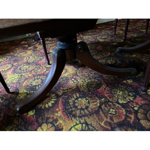 67 - Superb large oak dining table, 2 halves on 2 central 3 legged pods on brass castors. very good condi... 