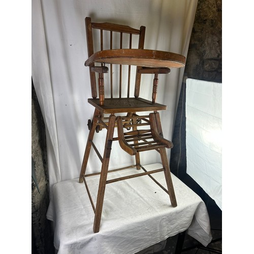 75 - A 19th century French childs high chair that folds down to a walker with original wheels