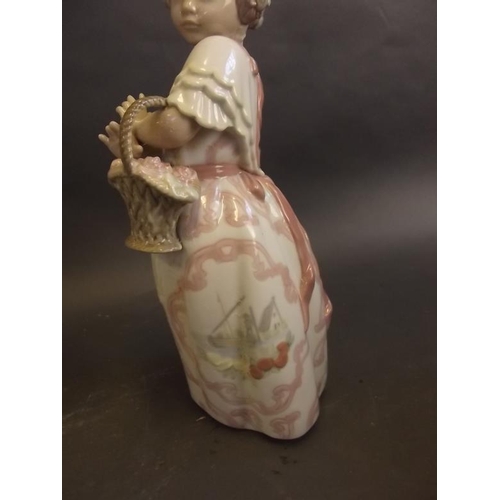 37 - A Spanish Zaphir porcelain figure of a young girl with a basket of flowers, with original box, and a... 