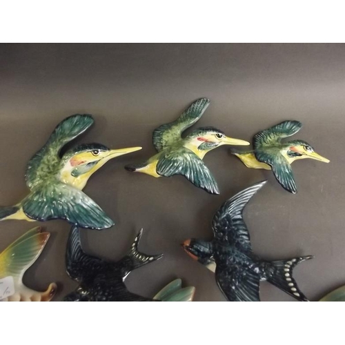 43 - A set of three Beswick figures of flying kingfishers, no. 729, five various flying ducks, and two sw... 