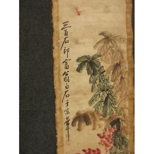 53 - A Chinese hand painted scroll decorated with a dragonfly and foliage, with calligraphy and seal mark... 