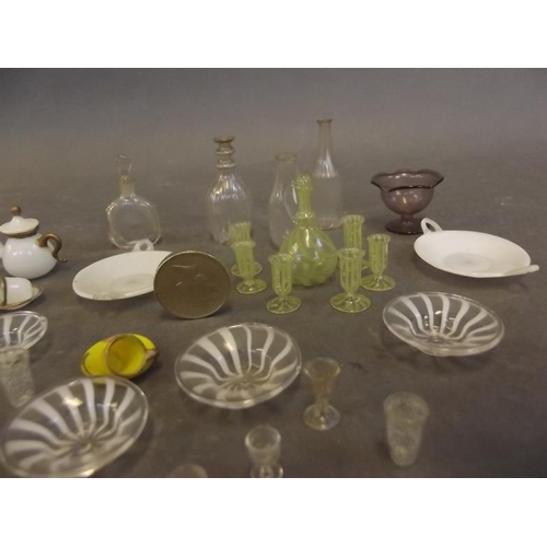 11 - A collection of miniature Venetian glass doll's house pieces including a whorl pattern decanter, and... 