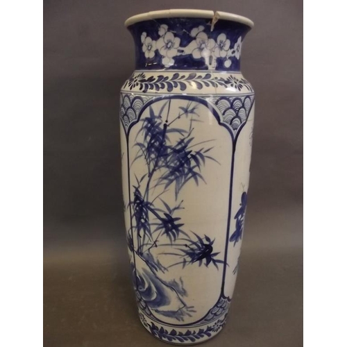 21 - A Chinese blue and white porcelain cylindrical vase decorated with flowering trees and bamboo, signe... 