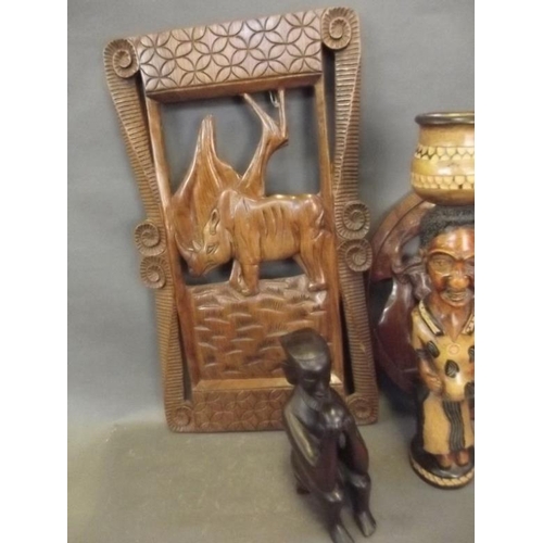 47 - Two carved African hardwood plaques, and two hardwood figural carvings, largest plaque 24