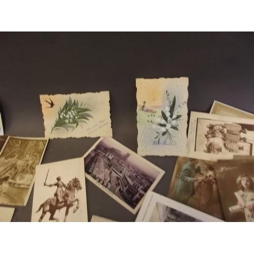 50 - A collection of postcards, mostly WWI including military vehicles, funerals, shipping greetings etc ... 