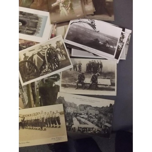 50 - A collection of postcards, mostly WWI including military vehicles, funerals, shipping greetings etc ... 