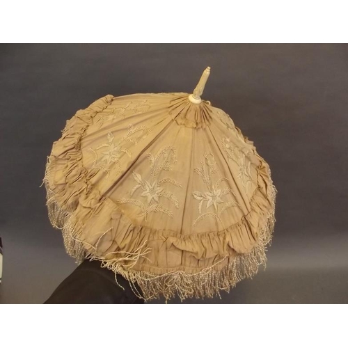 53 - A C19th lace parasol with carved ivory folding handle, 23