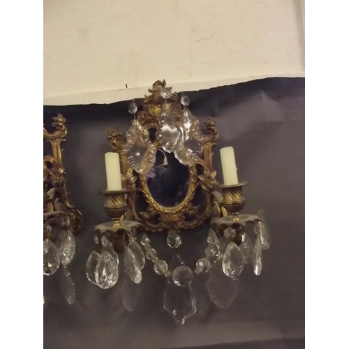 55 - A pair of French ormolu and crystal drop wall sconces, 17