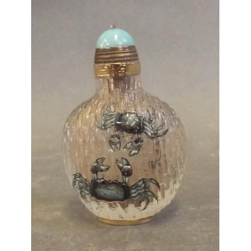 8 - A Peking glass snuff bottle with embossed decoration of fighting crabs, blue 4 character mark to bas... 