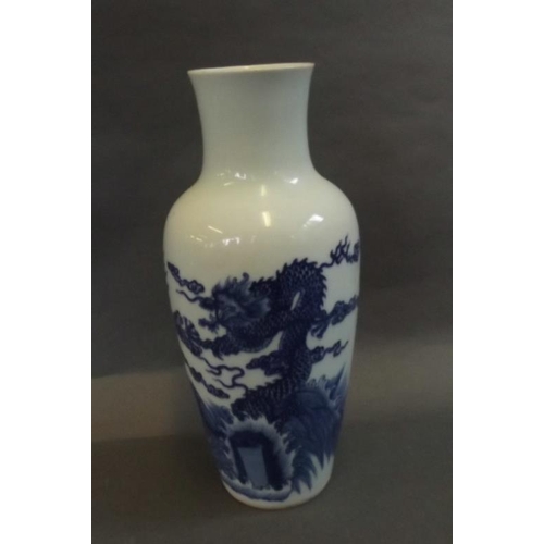 13 - A Chinese blue and white porcelain vase decorated with dragons, 6 character mark to base, 10