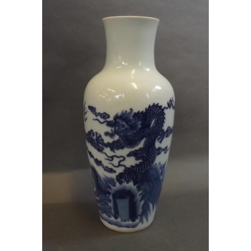 13 - A Chinese blue and white porcelain vase decorated with dragons, 6 character mark to base, 10