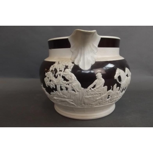 24 - A large C19th Jasperware jug in black and cream decorated with a hunting scene, 6