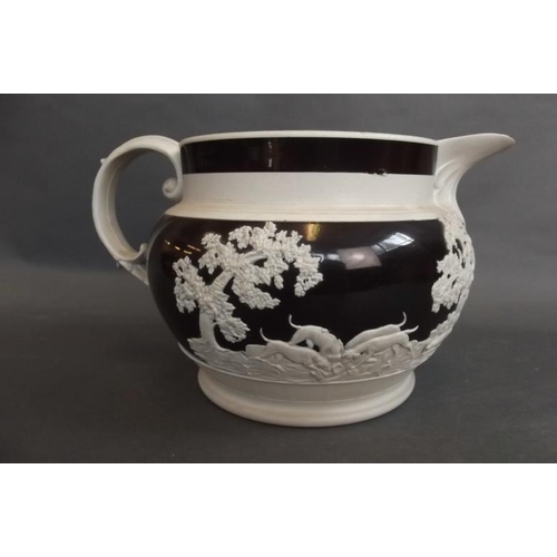 24 - A large C19th Jasperware jug in black and cream decorated with a hunting scene, 6