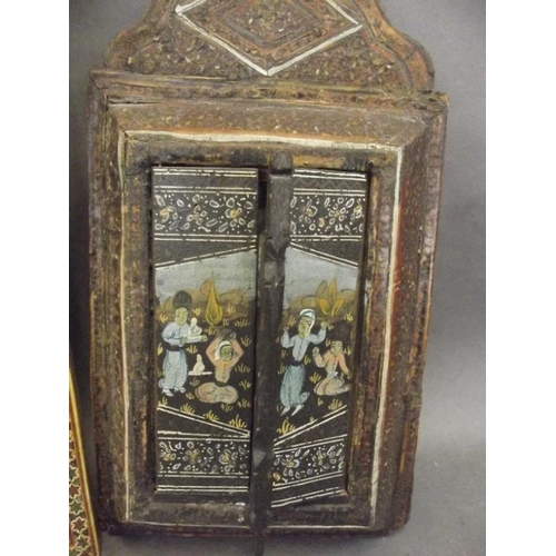 50N - A Kashmiri inlaid and painted wood hanging wall mirror, a panel decorated with peacocks and exotic b... 