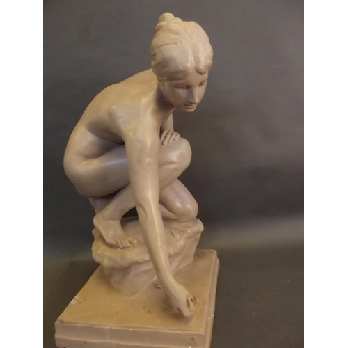 50T - A large terracotta figure of a nude girl with frog, 24