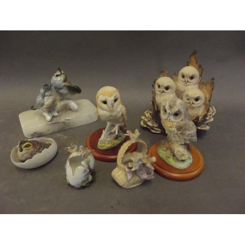 57 - A collection of bird figures including a nest of three tawny owl chicks, 4½