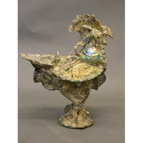 66 - An Eastern iridescent glass figure of a cockerel, 10½