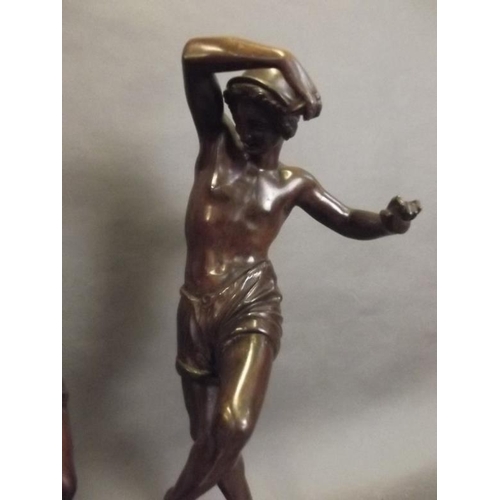 70 - A pair of bronze figures of dancing Neapolitan fishermen, the bases stamped 'A. Carrier', 17½