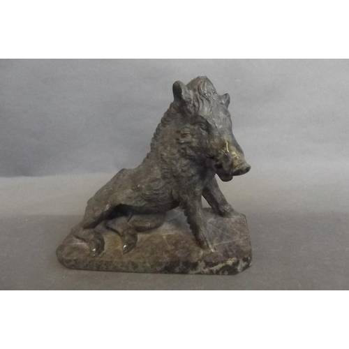 76 - A carved serpentine figure of a wild boar, 5½