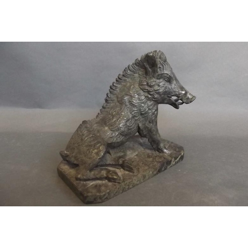 76 - A carved serpentine figure of a wild boar, 5½