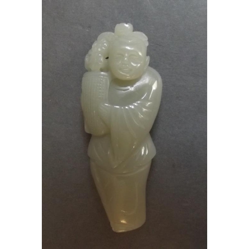 77 - A Chinese carved jade figure of a sage with a vase of flowers, 3