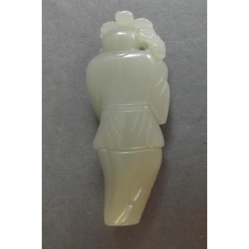 77 - A Chinese carved jade figure of a sage with a vase of flowers, 3