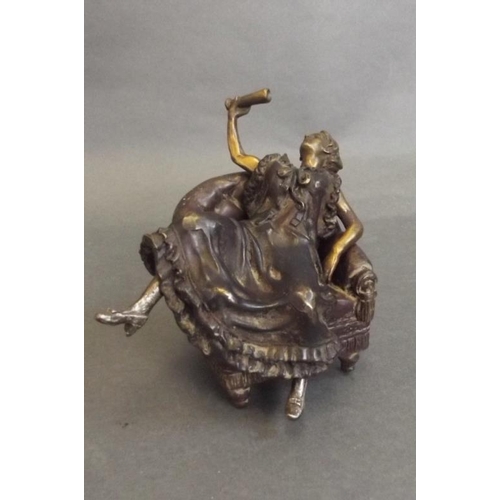 79 - A Vienna style cold painted bronze of a woman reclining on a chair with removable dress, impressed '... 