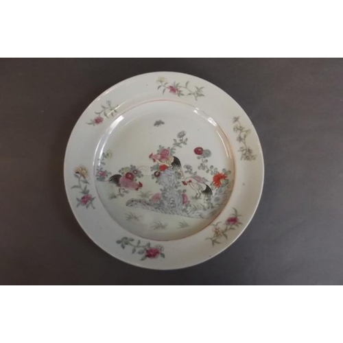 82 - A C19th Chinese porcelain plate decorated in bright enamels with cockerels in a flower garden, 10