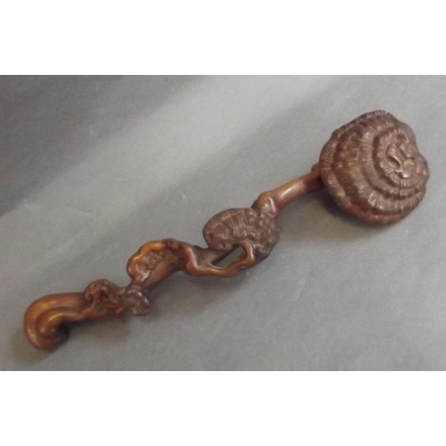 83 - A Chinese hardwood ruyi carved as a flowering tree, 13