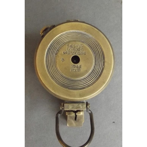 84 - A brass cased field compass, engraved 'T.G.C. & Co. Ltd., London', 2½