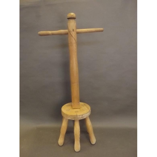 85 - An antique elm Posser washing dolly, 34