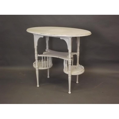 913 - A Continental painted three tier table with bobbin turned decoration, 33